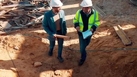 Man, engineer or clipboard on construction site for meeting, budget update or Stock Footage 336213689