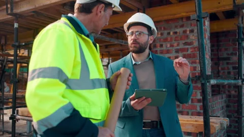 Man, engineer or tablet on construction site for meeting, budget update or Stock Footage 336220864