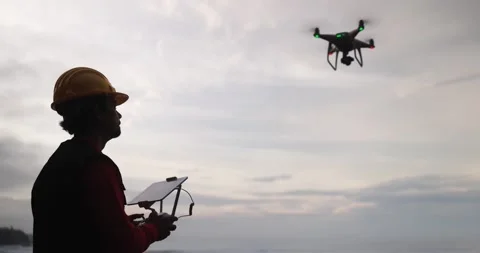 Man engineer pilot flying with drone - Video surveillance Stock Footage 145430672