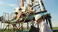 Man (engineer) with securities for the oil pumping unit Vídeos en HD