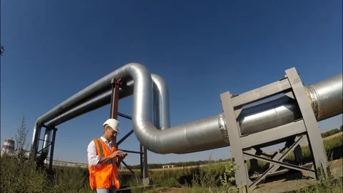 A man (engineer, worker, specialist) of an industrial landscape Video stock 73991667