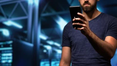 Man engineer working in server room Stock Photos