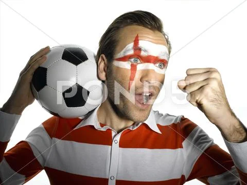 Man with English flag painted on face, shouting Stock Photos