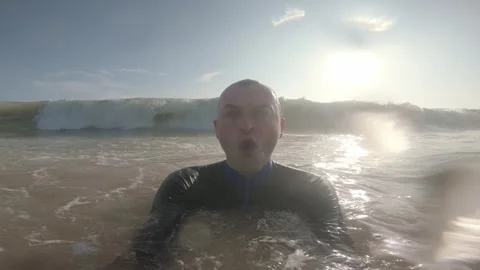 Man Engulfed by Breaking Ocean Wave at Mirissa Beach in Sri Lanka Stock Footage 340879680