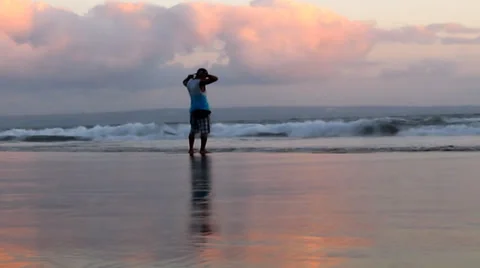 Man Enjoy sunset at the beach Bali Stock Footage 35290225