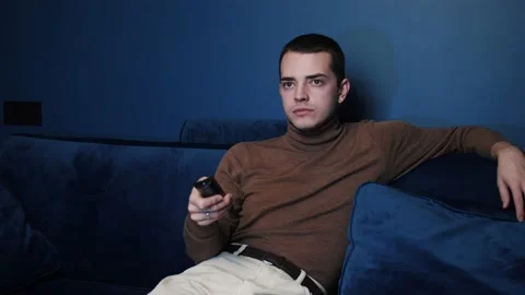 Man enjoy weekends resting lean sit on comfy sofa in living room alone, hold Video stock 144330803