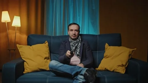 Man enjoy weekends resting lean sit on comfy sofa in living room alone, hold Stock Footage 198895213