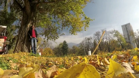 Man enjoying in autumn day in park Stock Footage