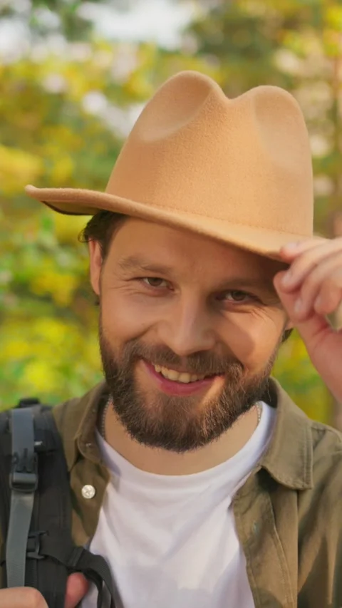 A man enjoying the beauty of nature while wearing a stylish hat in the great Stock Footage 316514268