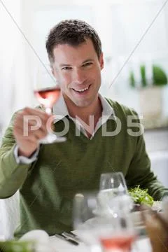 Man Enjoying A Glass Of Wine