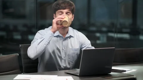 Man Enjoying Hot Beverage While Working in the Office Video stock 254442254