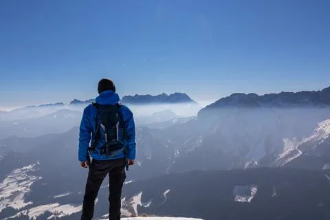 Man enjoying panoramic view from summit Freiberg of Karawanks, Julian Alps,.. Foto stock