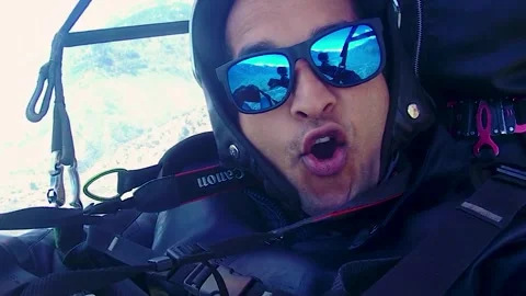 Man enjoying paragliding adventure at mountains at day 스톡 동영상 245408557