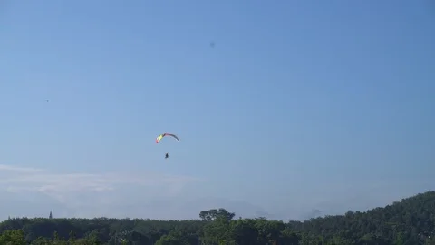 Man enjoying with paramotoring on blue sky sport Stock Footage 112805566