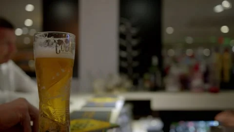 Man enjoying a pint at a bar Stock Footage 167267600
