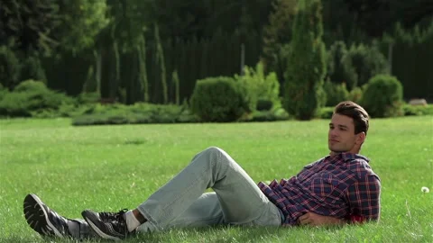 A man enjoying a rest on the grass Stock Footage 252680179