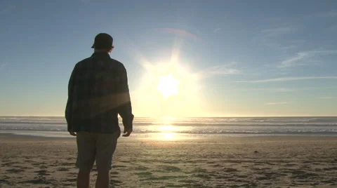 Man Enjoying Sunset At The Beach Stock-Footage 62272674