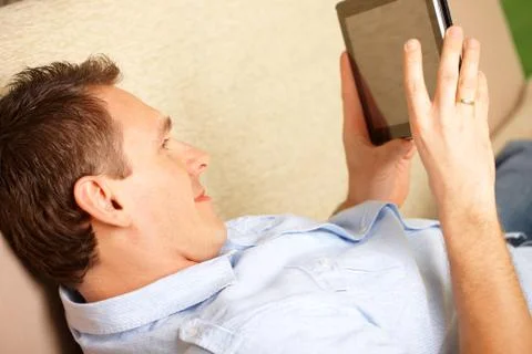 Man enjoying tablet Foto stock