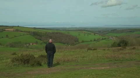 Man enjoying the view from Cothelstone Hill Stock Footage 272284366
