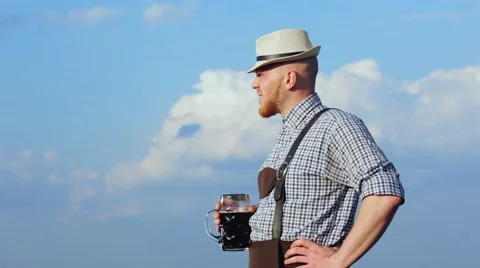 Man enjoys dark beer. Stock Footage 63196396