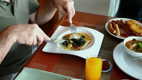 Man enjoys nutritious breakfast Stock Footage 256434216