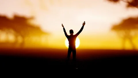 Man enjoys warmth and light from the sun, holds the sun between his palms Stock Footage 127745916