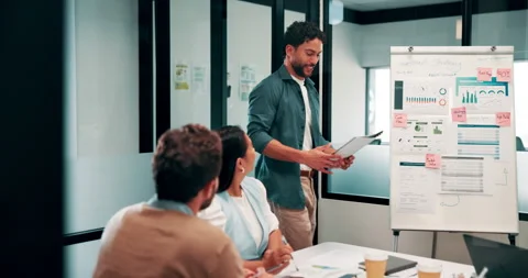 Man, enter and presentation in office with business people, stats and document Stock Footage 335923062
