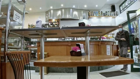 Man Enter in the Bar at Morning While Wears a Medical Mask Stock-Footage 143599150