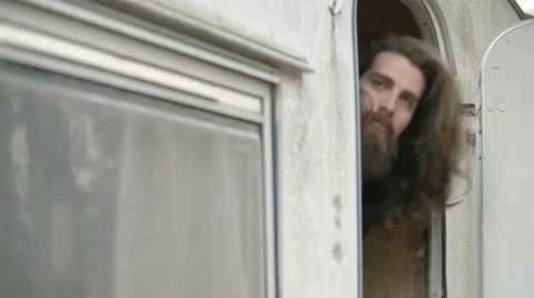 Man enter in caravan 動画素材 64575708