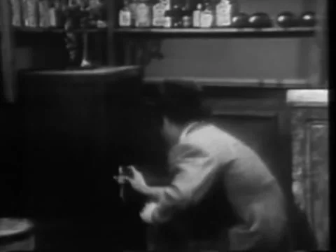 Man entering code on combination lock to open safe, 1940s Stock Footage 58858777