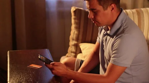 Man entering credit card data and making online money transfer using smartphone. Stock Footage 65402297