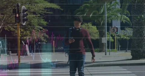 Man entering crosswalk while checking phone and starting finance data overlays, Stock Footage 331379939