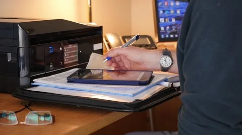 Man entering data on a iPad. Stock Footage 49910874