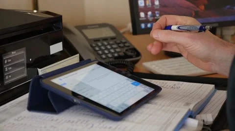 Man entering data on a iPad. Stock Footage 49911555