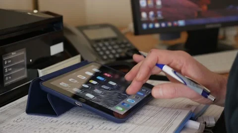 Man entering data on a iPad. Stock Footage 49911825