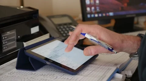 Man entering data on a iPad. Stock Footage 49911888