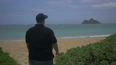 Man Entering An Empty And Secluded Lanikai Beach In Oahu, Hawaii Stock Footage 154306540