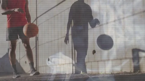 Man entering left, walking and dribbling basketball, wall shadow shifting with Stock Footage 333893800