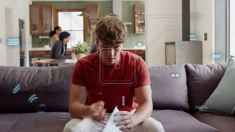 Man entering with mail, sitting on couch checking bills while finance graphics Stock Footage 332937683