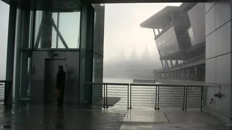 Man Entering Outdoor Elevator On Early Morning Fog Stock Footage 19105182