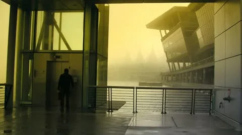 Man Entering Outdoor Harbour Elevator In Yellow Mist Stock Footage 19111320