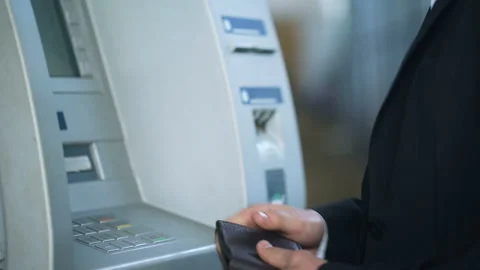 Man entering pin code on ATM keyboard and receiving euros, 24 hour service Stock Footage 90915477