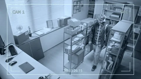 Man Entering Warehouse Office Captured on CCTV Security Camera Stock Footage 342799430