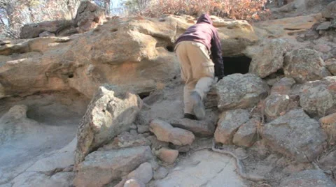 Man Enters Cave Stock Footage 20491142