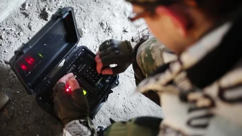 Man enters code in case with time-bomb for playing lasertag game Video stock 276359229