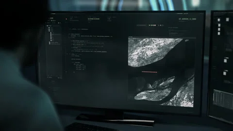 Man enters the code into the web application to create interactive system Stock Footage 201420429