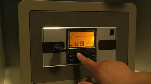 A man enters the correct code into the keypad of a safe 스톡 동영상 277592732