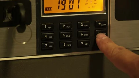 A man enters the correct code into the keypad of a safe 스톡 동영상 277592777