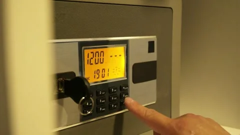 A man enters the correct code into the keypad of a safe 스톡 동영상 277592837
