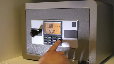 A man enters the correct code into the keypad of a safe 스톡 동영상 277592900